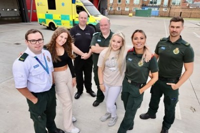 Patients Tilly and Ellie with the emergency services colleagues who saved their lives back in March 2022.jpg